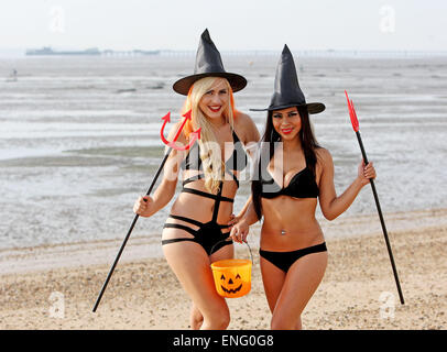 Dancers Sophie Lambert and Stephany Paredes pose together on Southend beach, wearing skimpy Halloween outfits.  Featuring: Sophie Lambert,Stephany Parades Where: Southend, United Kingdom When: 31 Oct 2014 Stock Photo