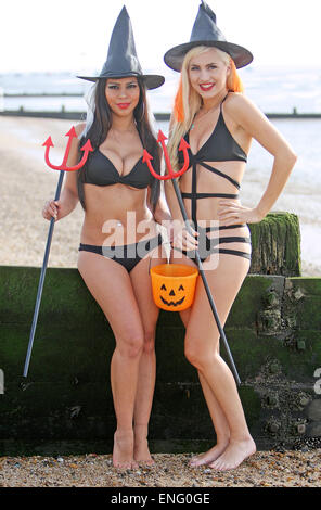 Dancers Sophie Lambert and Stephany Paredes pose together on Southend beach, wearing skimpy Halloween outfits.  Featuring: Stephany Paredes,Sophie Lambert Where: Southend, United Kingdom When: 31 Oct 2014 Stock Photo