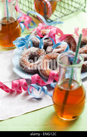 Finnish traditional Vappu food, sugar donuts with sima Stock Photo