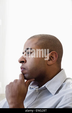 Close up profile of serious face of mixed race businessman Stock Photo