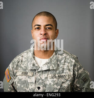 Close up of mixed race soldier smiling Stock Photo