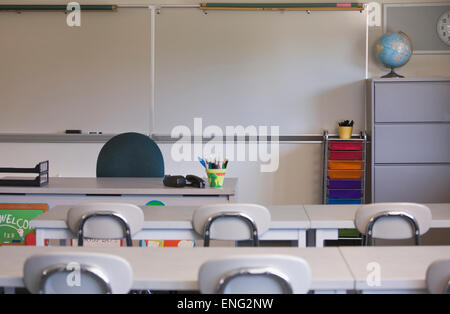 Empty desks in classroom Stock Photo