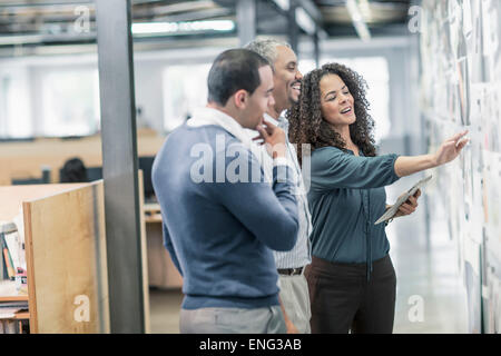 Business people using digital tablet in office Stock Photo