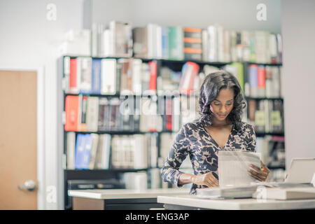 African American businesswoman working in office Stock Photo - Alamy
