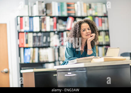 Mixed race businesswoman working in office Stock Photo