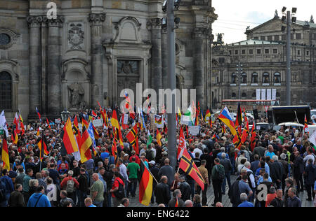 Dresden, Germany. 04th May, 2015. People participate in a rally by anti-Islam movement Pegida (Patriotic Europeans against the Islamization of the West') with Germany flags (L) and flags which were proposed by German resistance fighter Josef Wirmer as a national flag in 1944 (R), in Dresden, Germany, 04 May 2015. The 'Patriotic Europeans against the Islamization of the West' (Pegida) have gathered again for another rally in the Saxon capital. Photo: MATTHIAS HIEKEL/dpa/Alamy Live News Stock Photo