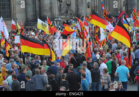 Dresden, Germany. 04th May, 2015. People participate in a rally by anti-Islam movement Pegida (Patriotic Europeans against the Islamization of the West') with Germany flags in Dresden, Germany, 04 May 2015. The 'Patriotic Europeans against the Islamization of the West' (Pegida) have gathered again for another rally in the Saxon capital. Photo: MATTHIAS HIEKEL/dpa/Alamy Live News Stock Photo