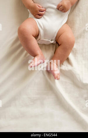 Close up of legs of mixed race baby boy Stock Photo