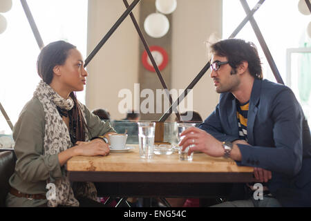 Serious couple talking in cafe Stock Photo