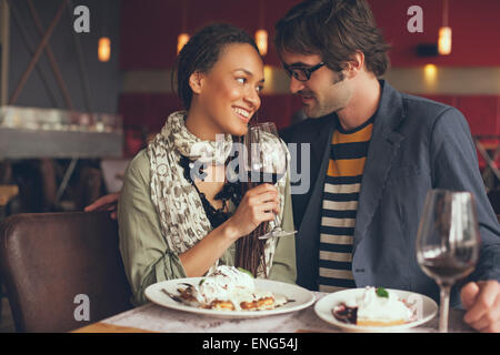 Couple eating dinner in cafe