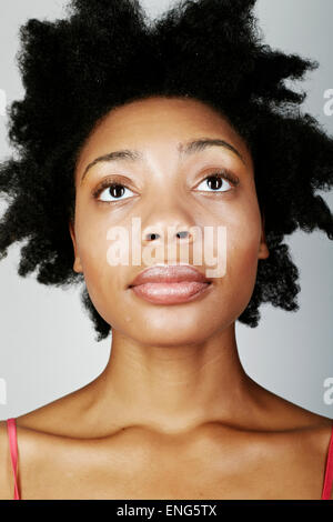 Close up of serious black woman looking up