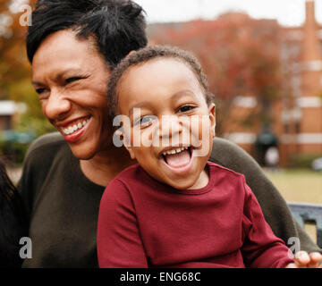 Close up of African American mother and son laughing Stock Photo