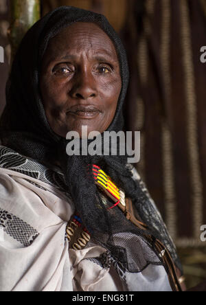 Close-up of an old Turkana woman with massive colorful beaded necklaces ...