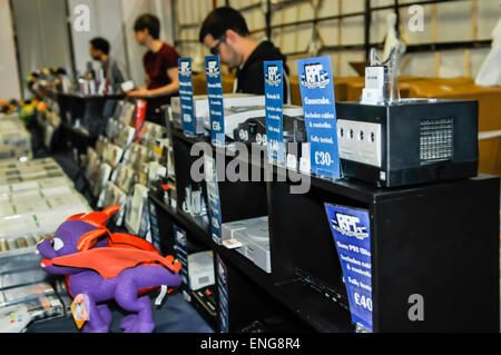 Retro video game consoles and cartridges for sale at a market stall Stock Photo