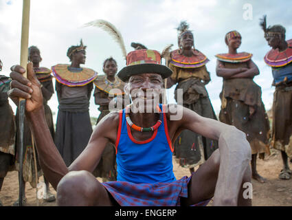 Pokot Tribe People Man Pausing In Front Of The Women, Baringo County, Baringo, Kenya Stock Photo