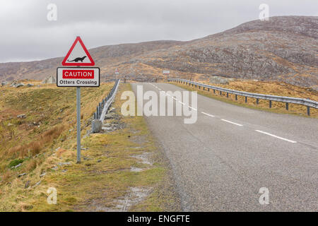 A road sign on the Scalpay bridge with the words Caution Otters Crossing Stock Photo