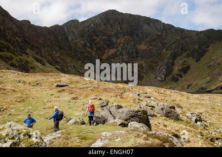 Hikers in glacial Cwm Cau in Cadair Idris mountain massif (Cader Idris) National Nature Reserve Snowdonia National Park north Wales UK Britain Stock Photo