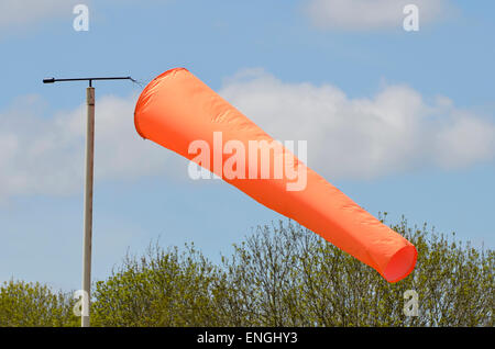 Airfield windsock, used to indicate wind speed and direction, shown ...