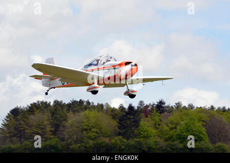 An unidentified modern light aircraft takes off from Popham Airfield in Hampshire. Stock Photo