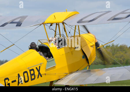 A de Havilland DH.82 Tiger Moth biplane prepares for take-off at Popham Airfield Stock Photo