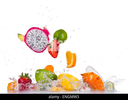Mix of fresh fruit with water splashes isolated on black background Stock Photo