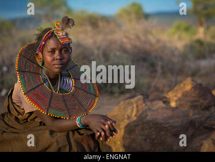 A Pokot Girl Wears Large Necklaces Made From The Stems Of Sedge Grass, Baringo County, Baringo, Kenya Stock Photo