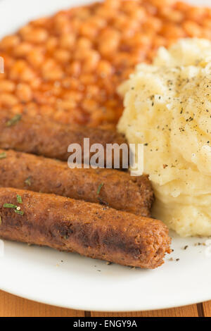 traditional bangers mash and baked beans but vegetarian style twist on the theme Stock Photo