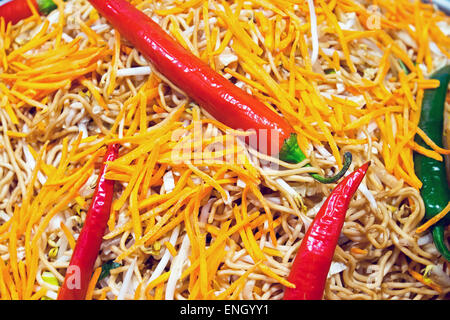Red peperoni with thai food seen at a market Stock Photo