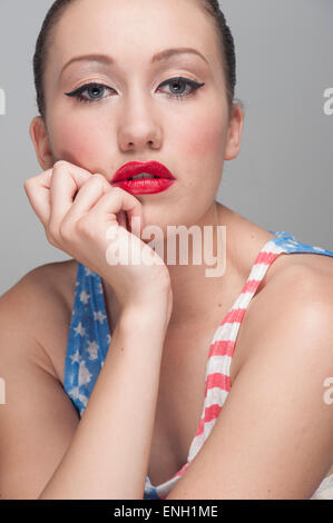 Beauty portrait of young woman wearing an American flag top Stock Photo