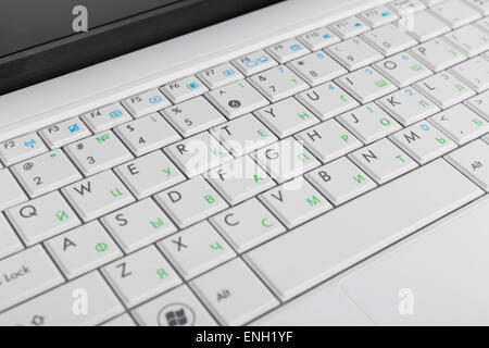 Closeup of the white netbook keyboard. With cyrillic symbols. Stock Photo