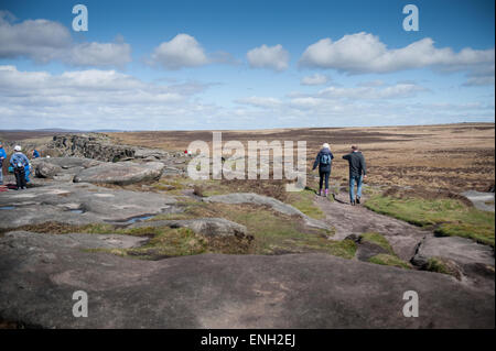 Walkers on Stanage Edge in the Peak District Stock Photo