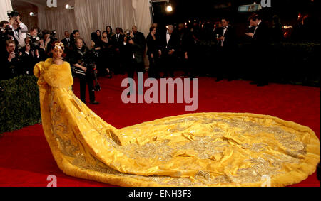 New York, New York, USA. 4th May, 2015. RIHANNA arrives wearing a yellow fur-trimmed, embroidered cape on the red carpet at the Met Gala on Monday evening for the Costume Institute Gala Benefit 'China: Through the Looking Glass.' © Nancy Kaszerman/ZUMAPRESS.com/Alamy Live News Stock Photo
