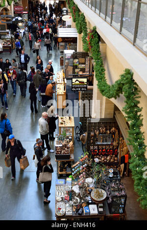 Interior view Farmers Market Ferry Building with food produce shops and stalls at Christmas Embarcadero San Francisco California Stock Photo