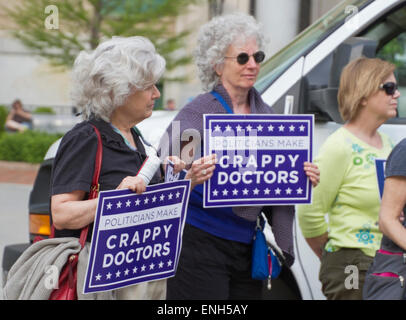 Asheville, North Carolina, USA - May 4, 2015:  Older women hold signs saying politicians make crappy doctors to protest North Carolina's abortion Bill #465 which increases restrictions for women seeking abortions, May 4, 2015 in downtown Asheville, NC Credit:  Judith Bicking/Alamy Live News Stock Photo