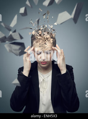 Smart businessman with a huge migraine Stock Photo