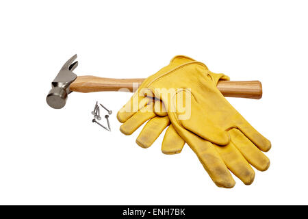 Studio photograph of  used hammer, nails, and used leather gloves isolated on white Stock Photo
