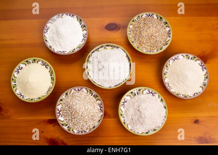 Various kinds of flour and grains including bread flour, ten grain cereal, kamut flour, whole wheat flour, oat bran & rye flour Stock Photo