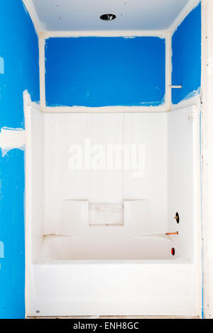 Bathtub install in new home construction Stock Photo - Alamy