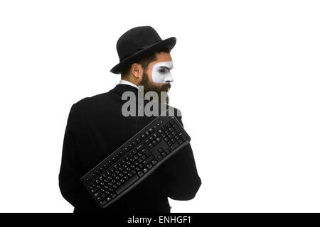 mime as a businessman holdinga keyboard behind Stock Photo
