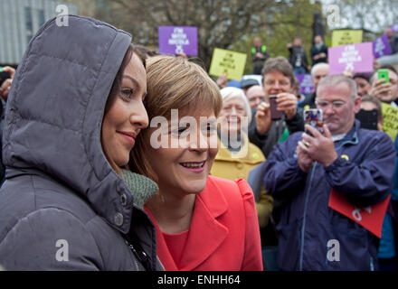 Party leader braves the dreich Scottish weather with supporters to hold a street stall event at The Mound Edinburgh to talk to voters about the SNP's alternative to austerity the day before the general election. Stock Photo