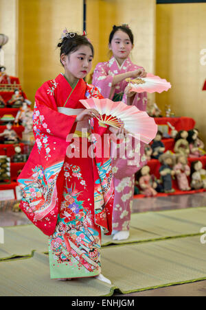 Young Japanese girls dressed in traditional kimono during the Hinamatsuri or Hina Doll Festival at the Shinnanyo Fureai Center March 7, 2015 in Shunan City, Japan. The festival is a day in Japan when parents celebrate their daughter's happiness, growth and good health. Stock Photo