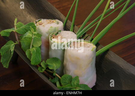 Goi cuon, Vietnamese fresh spring rolls. Shrimp, vermicelli, chicken, lettuce, egg are wrapped in translucent rice paper sheet. Stock Photo