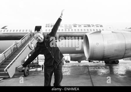 Head of Laker Airways Freddie Laker in jubilant mood on the runway at Gatwick airport, the day before the inaugural flight of his transatlantic Skytrain service takes off from Gatwick to New York. The flight will seat 345 passengers and will cost £59 for Stock Photo