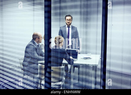Serious co-workers having consultation in office Stock Photo