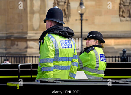 London, England, UK. Two police officers outside the Houses of Parliament Stock Photo