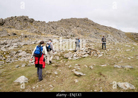 Hikers on last section of Minffordd path to Penygadair summit of Cadair Idris (Cader Idris) mountain range in Snowdonia Wales UK