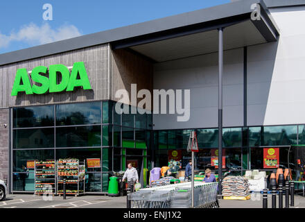 Asda supermarket store entrance with trolleys in car park outside the shop front. Bangor, Gwynedd, Wales, UK, Great Britain Stock Photo