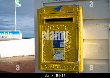 Traditional French post box in seaside setting, Normandy, France Stock Photo