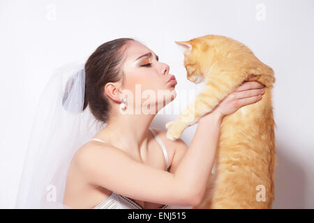 Beautiful bride with red cat Stock Photo