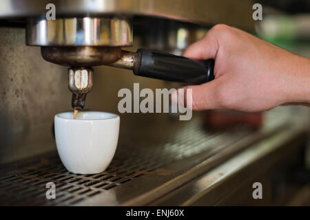Barista pulling espresso shot-close-up Stock Photo